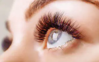 A close up of the eye with long eyelashes